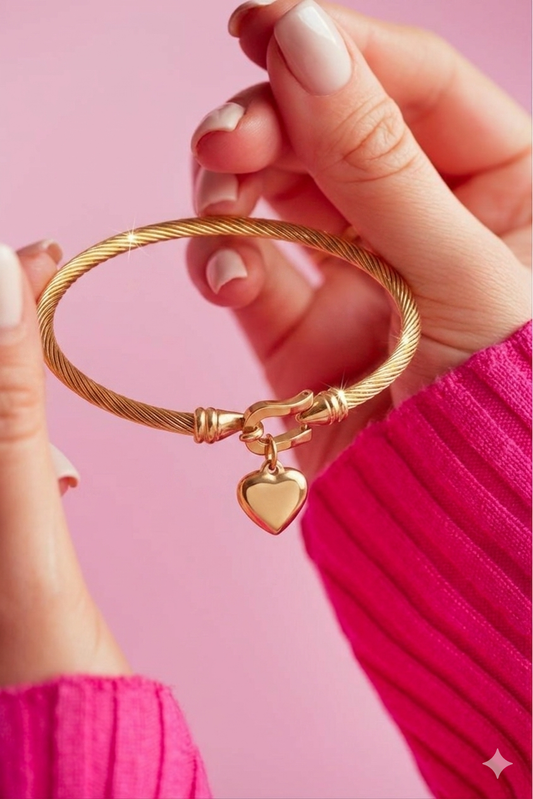 Golden knot statement bangle with heart charm
